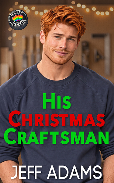 Book cover for His Christmas Craftsman by Jeff Adams. A handsome young man with tousled reddish-brown hair, light stubble, and a warm smile wears a navy blue shirt. Behind him is a softly blurred workshop decorated with glowing Christmas lights.